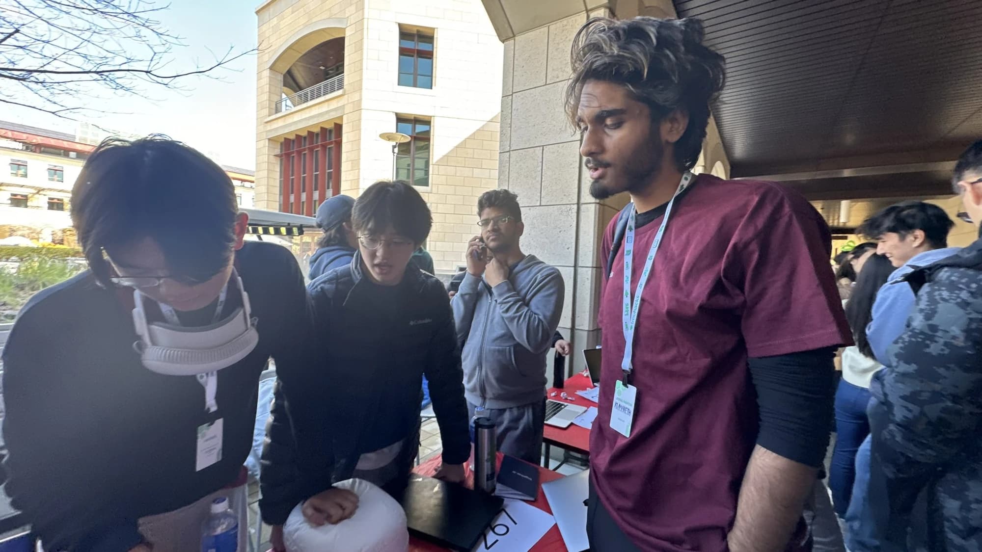 Looking at a project demonstration with a group of students.
