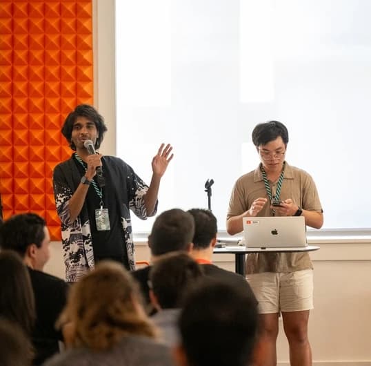 Presenting to an audience with Mark Rachapoom.